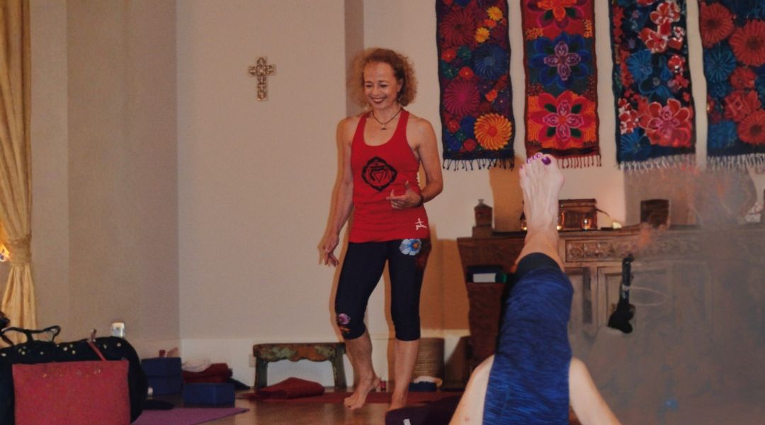 Sandy in yoga pose with client wide